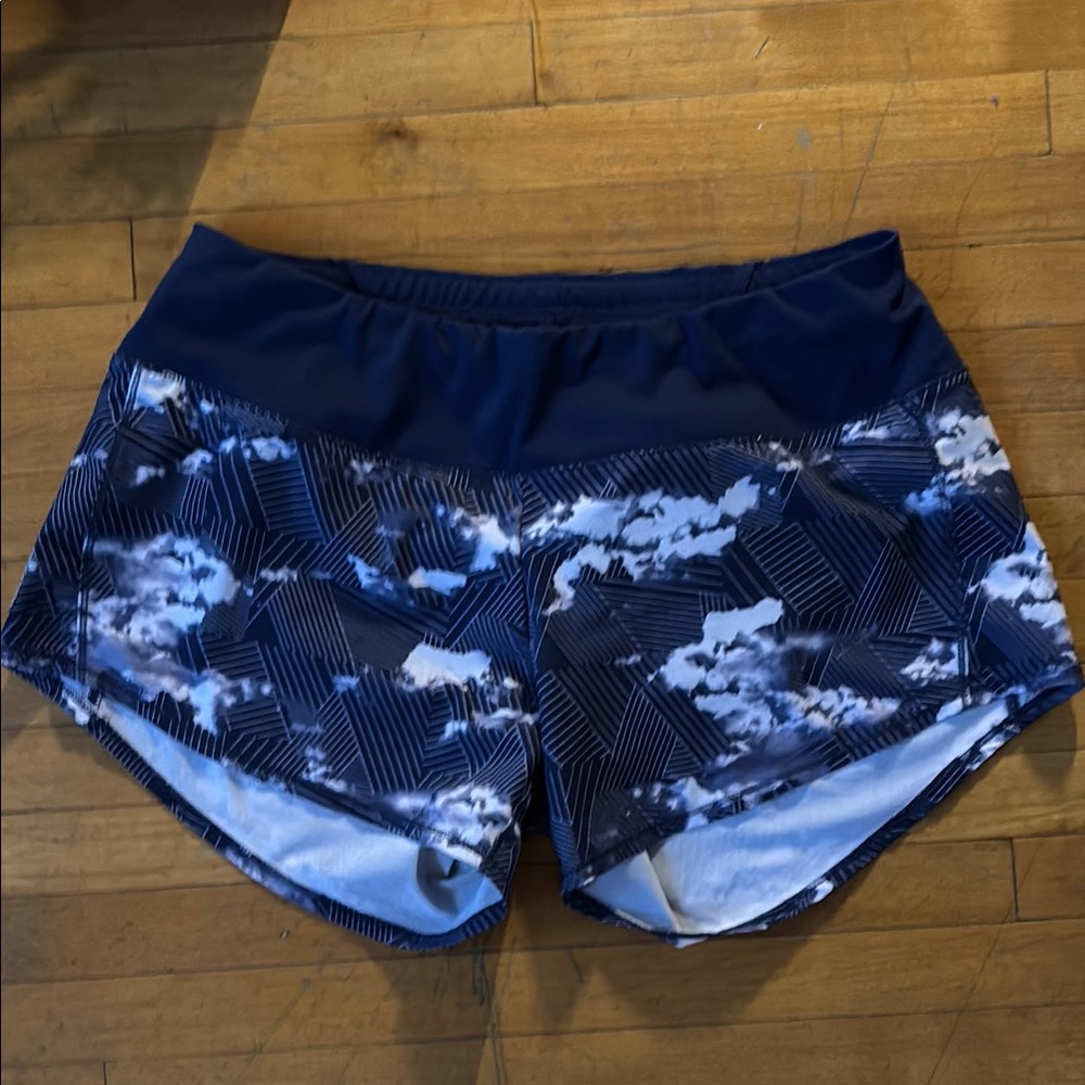 Blue Patterned “Roga” running shorts by Oiselle